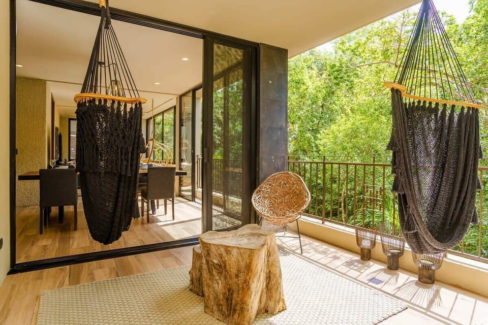 Terrace with awesome hanging hammocks!