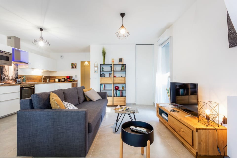 Bright living room with a double sofa bed, tv and internet