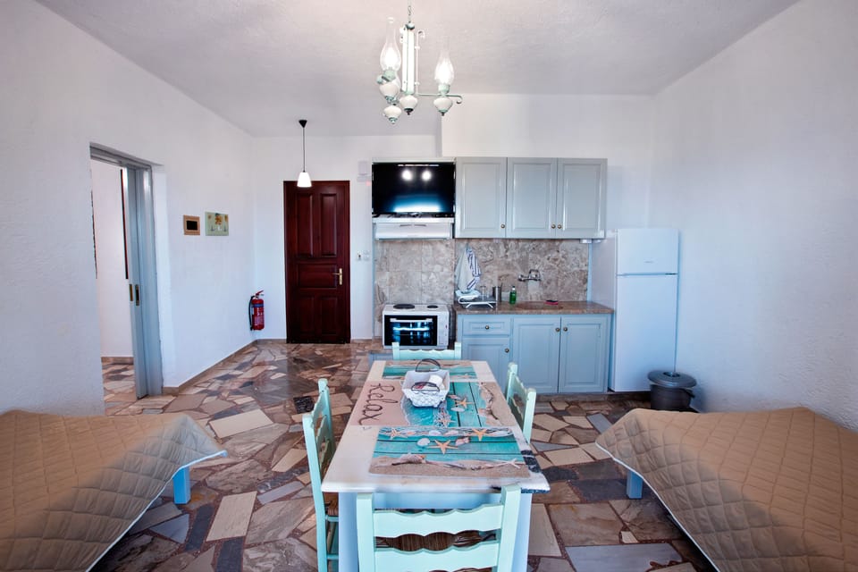 Apartment, 1 Bedroom, Balcony, Ocean View | Private kitchen | Stovetop, coffee/tea maker, electric kettle, highchair