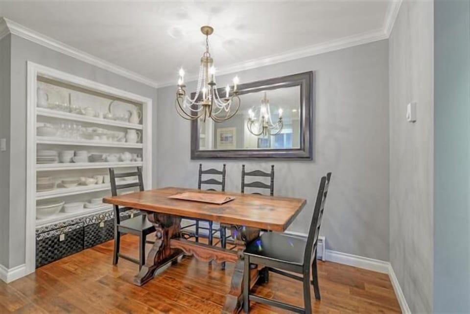 Gather around the dining table that comfortably seats four, perfect for shared meals and quality time