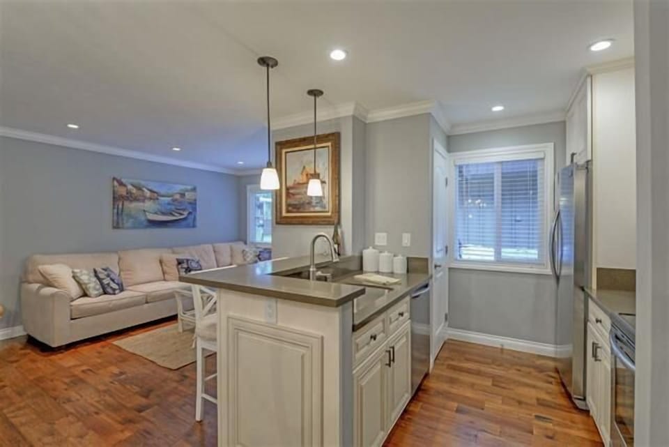 Enjoy a fully stocked kitchen featuring sleek stainless steel appliances, perfect for preparing meals with ease