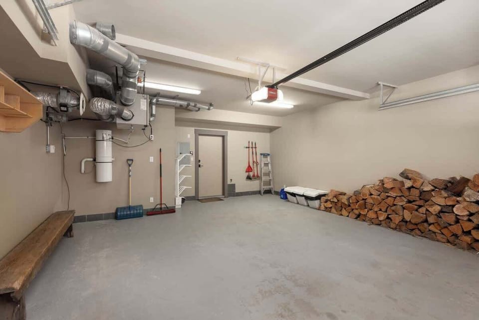 - Spacious garage with organized storage and firewood stack  
- Ideal for gear, bikes, and winter equipment storage  
- Perfect utility area for active mountain guests  
