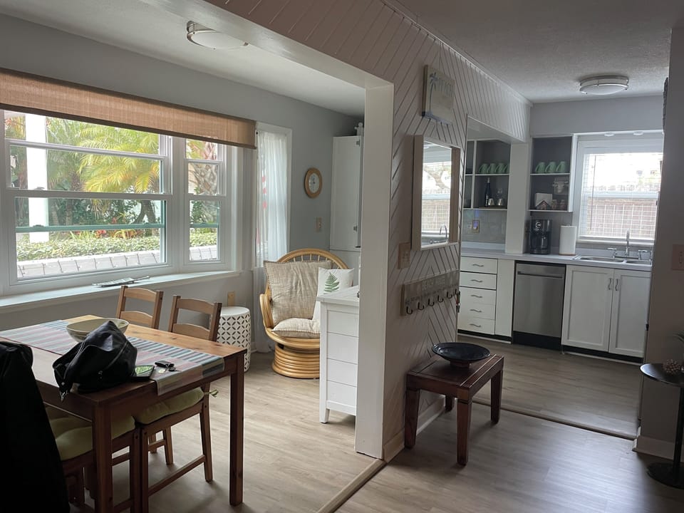 Kitchen and dining area with bay window, as seen from the living room.