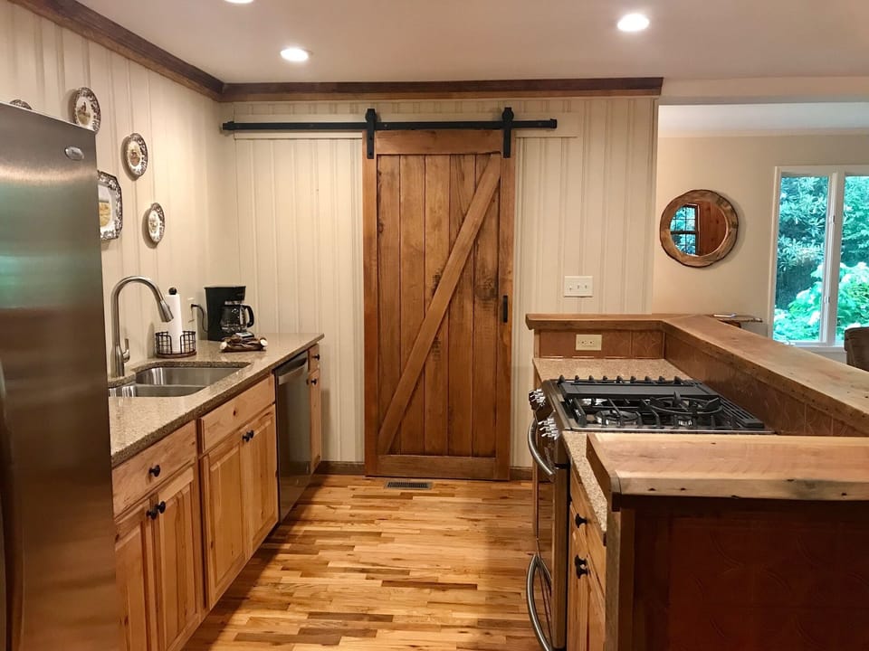 Behind the barn door is an expansive pantry for all your grocery items