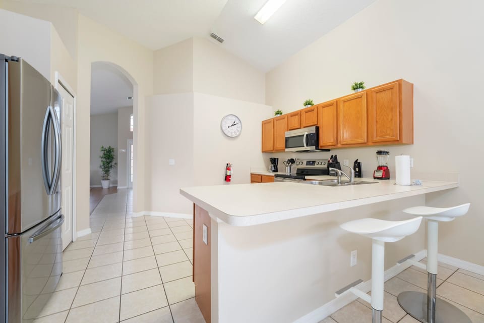Alternate view of the breakfast bar and kitchen