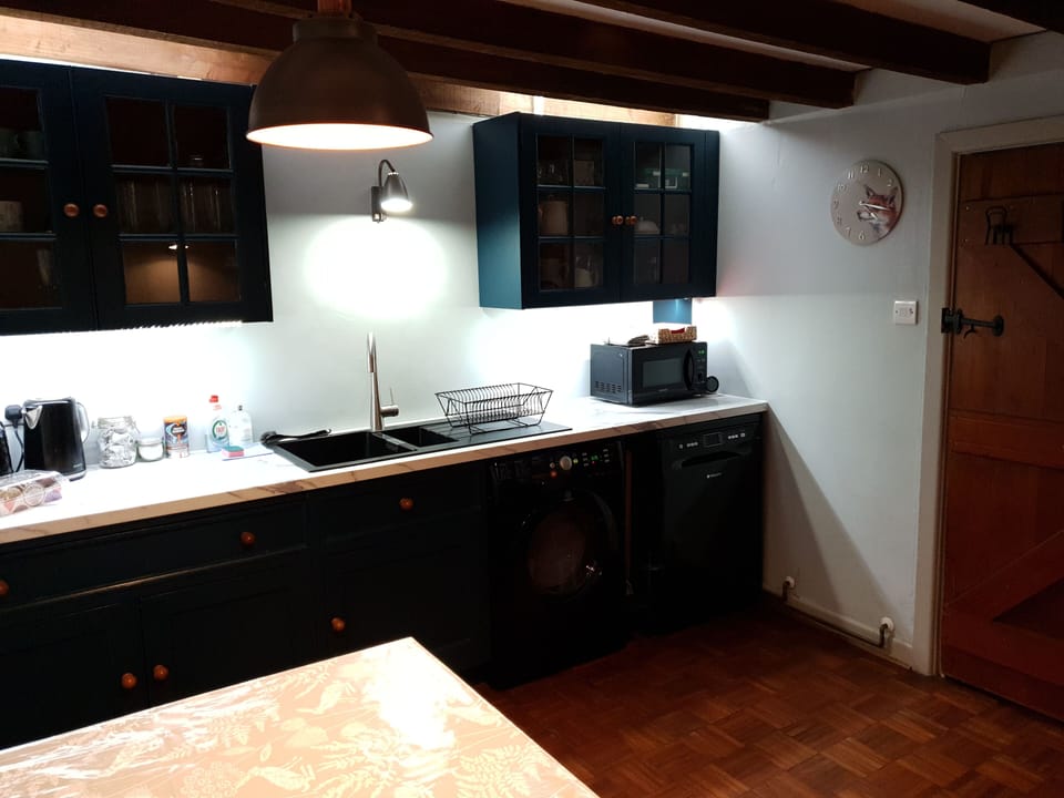 Beamed kitchen with microwave,  dishwasher, fridge/freezer, double oven & hob.