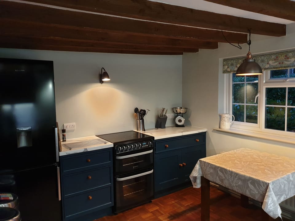 Beamed kitchen with microwave,  dishwasher, fridge/freezer, double oven & hob.