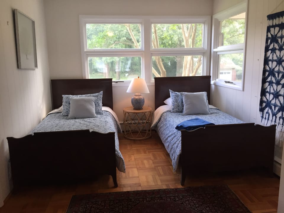BR #3 is separated from the open area of the house by a wooden accordion wall.