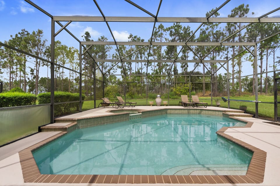 Oversized pool and spa with deck over looking golf course 