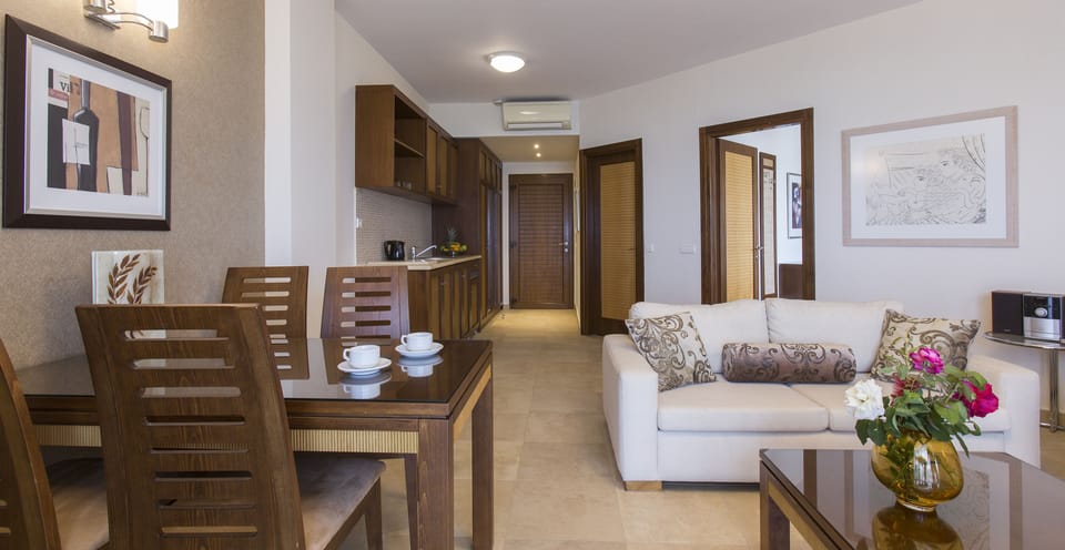 Suite, Beachfront (OLYMPIA) | Living area | TV