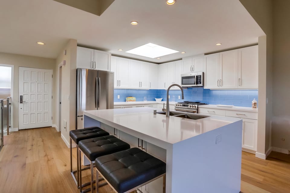 Gather around the kitchen island for breakfast before heading out.