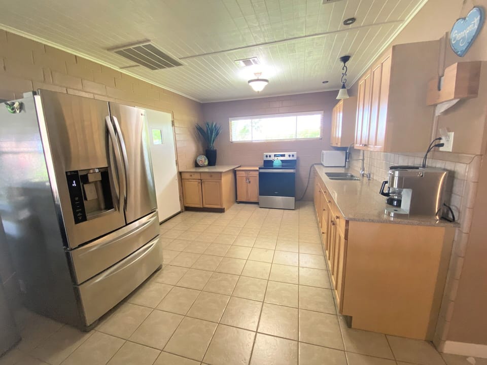 Large refrigerator and two freezer drawers provide plenty of space for groceries