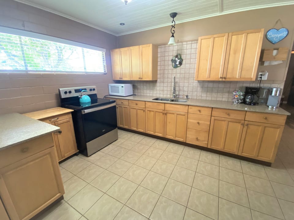 Spacious kitchen is fully stocked.