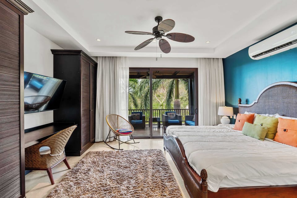Sleep like royalty with a king-sized bed and tropical views.