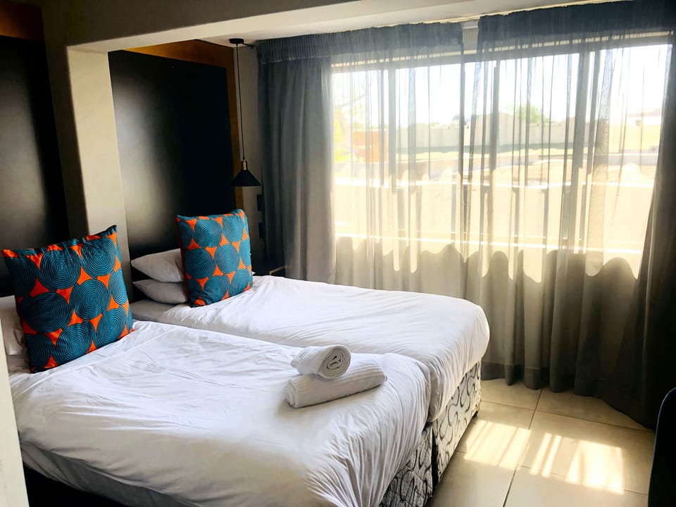 Family Room (First Floor) | Minibar, individually decorated, individually furnished, bed sheets