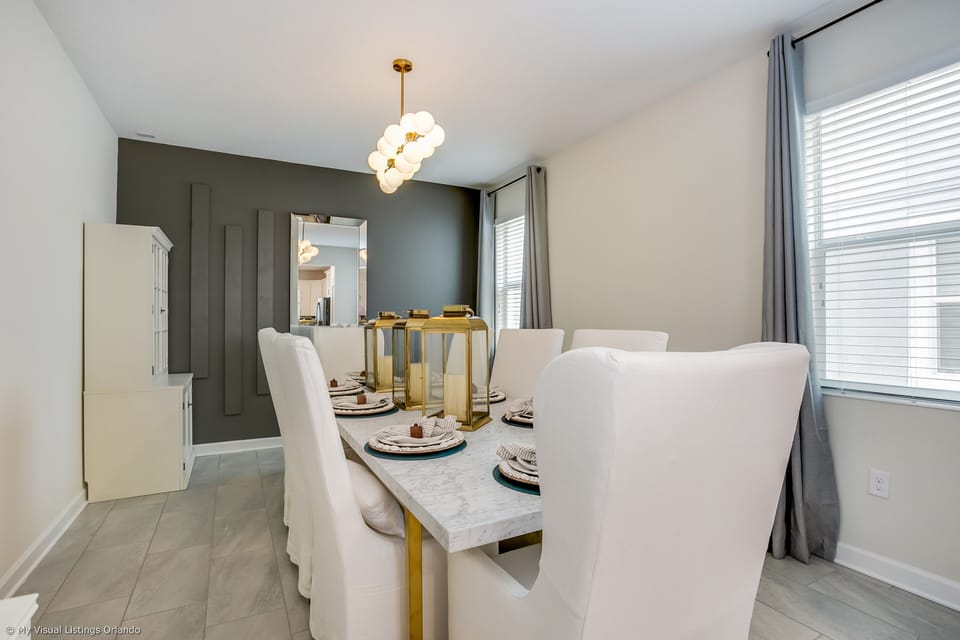 - Elegant Dinging Area of the Home in Florida - Offers a timeless and inviting space to gather and enjoy memorable meals  - 8 Persons Dining - Statement lighting fixtures