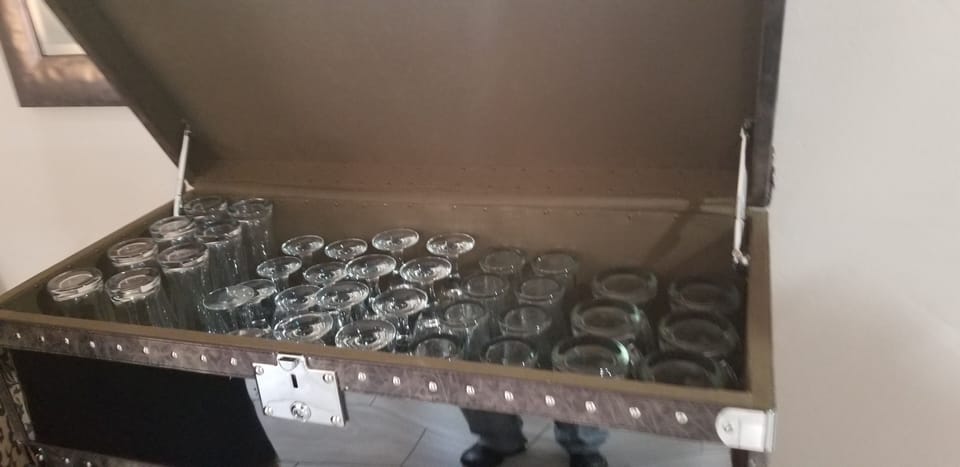 Glassware is located in the large trunks near the kitchen!
