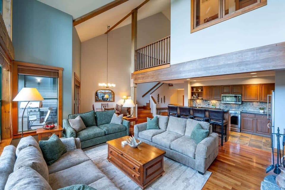 - Expansive living area with open loft design and natural light  
- Modern kitchen and cozy lounge for family gatherings  
- Warm wood accents bring classic alpine style throughout