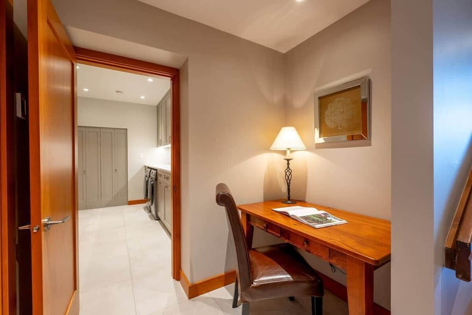 - Quiet workstation with desk and lamp for focused productivity  
- Peaceful corner perfect for reading, journaling, or planning trips  
- Convenient access to laundry and nearby guest rooms  