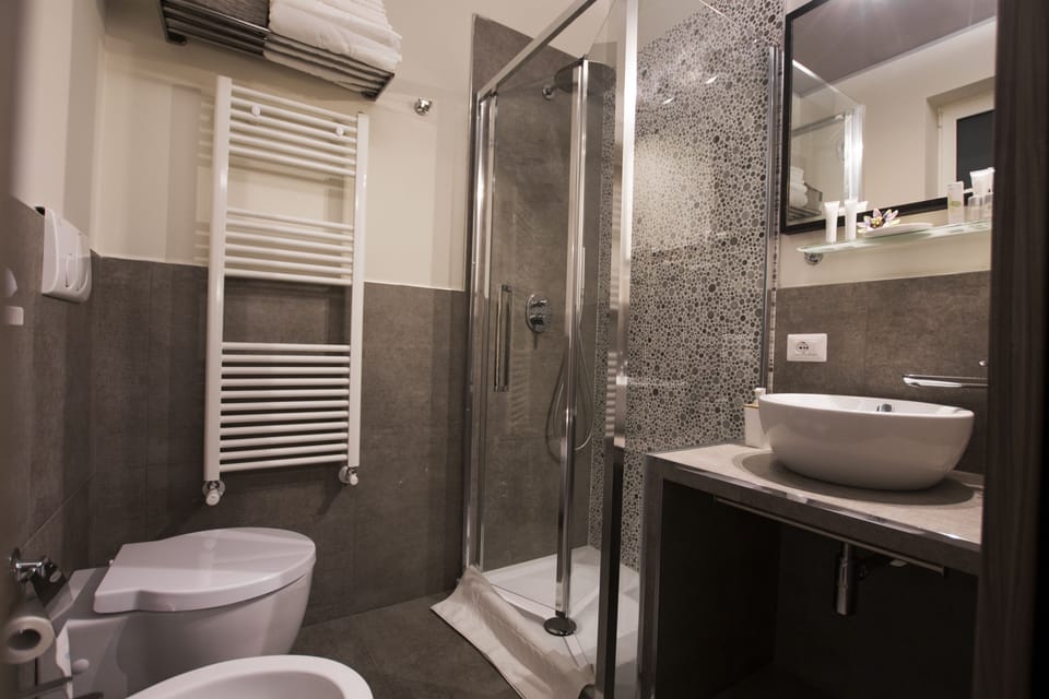 Shower, bathrobes, slippers, bidet