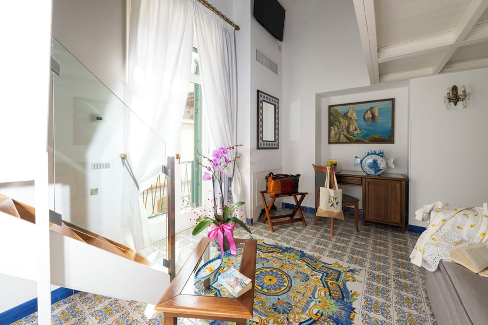 Junior Suite, 1 Bedroom, Balcony | 1 bedroom, individually decorated, individually furnished, desk