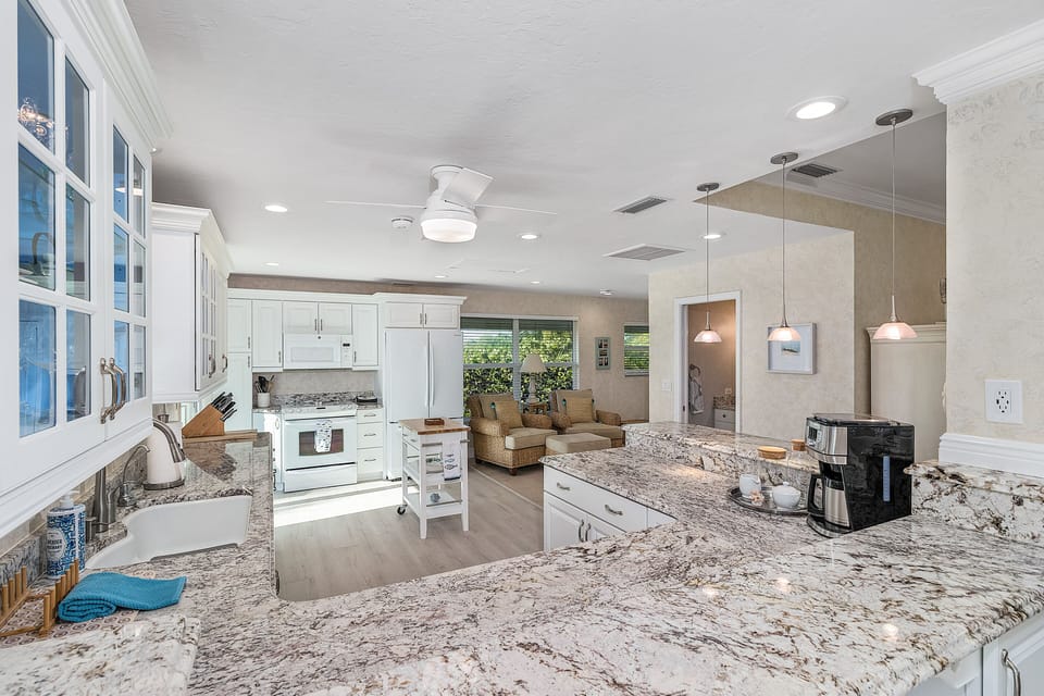A large granite top kitchen makes it easy to cook and entertain 