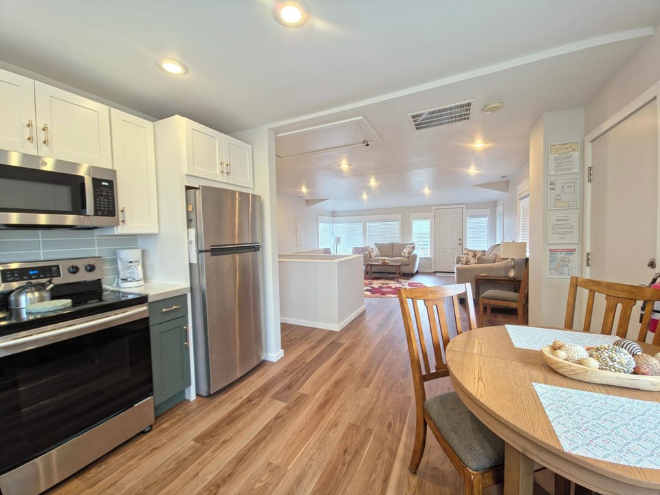 Your open-concept space flows seamlessly from kitchen to living area, creating the perfect backdrop for memorable meals and conversations.