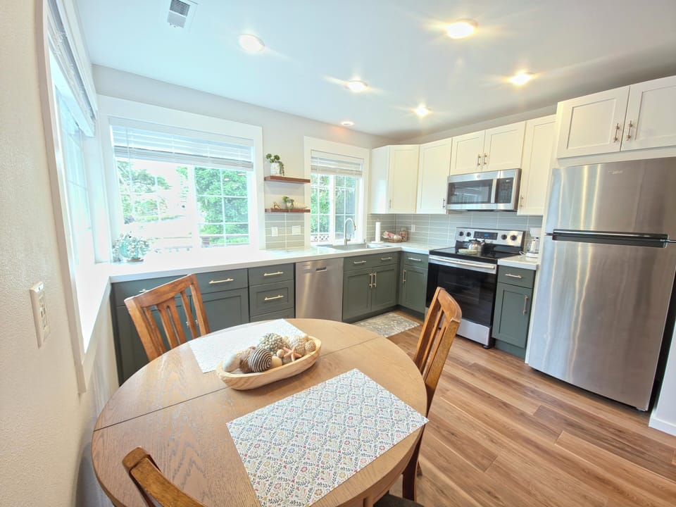 Your beautiful kitchen awaits with modern appliances, plenty of counter space, and a cozy dining nook where you can enjoy morning coffee.