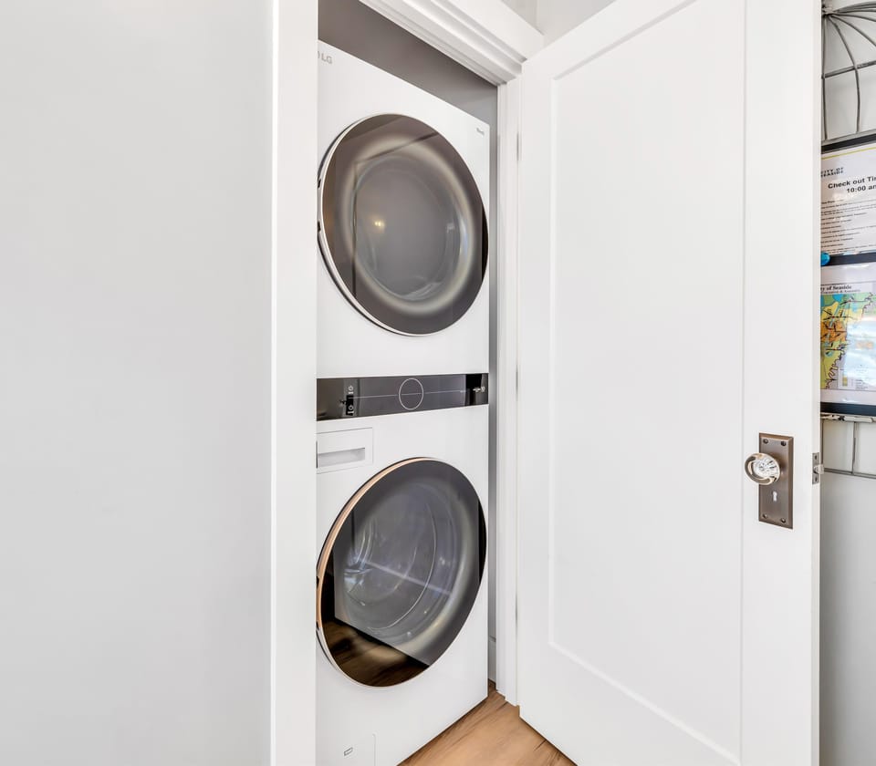 Your laundry needs are covered with this sleek stacked washer and dryer—effortlessly tucked away yet ready whenever you need it.