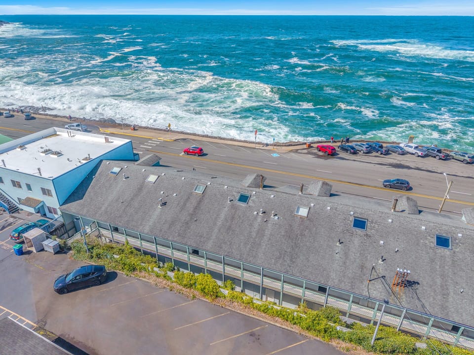 Oceanfront property with direct beach access and convenient parking steps from crashing Pacific waves.
