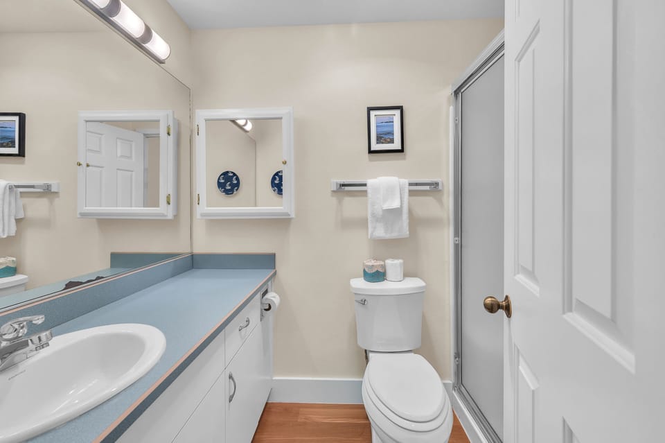 Your private bathroom features modern amenities and bright lighting, creating a clean and comfortable space for your daily routine.
