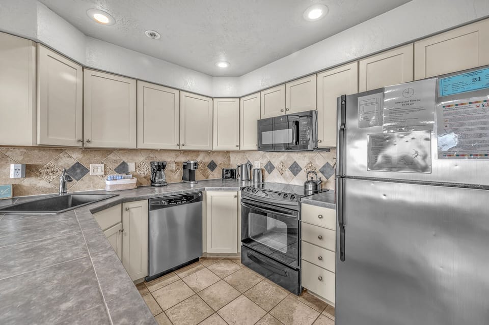 Your fully-equipped kitchen features modern appliances and ample counter space for preparing your favorite meals during your stay.