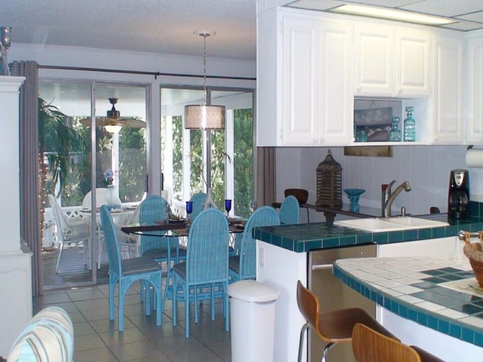 Dining room with access to screened porch area overlooking the pool
