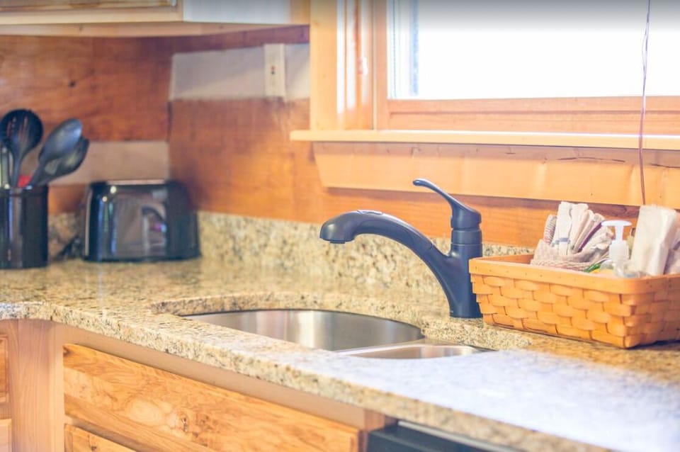 Granite counters and a window with a view.