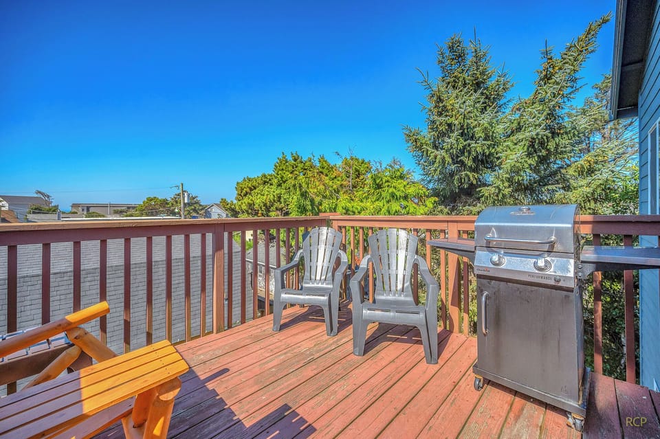 Soak up sunshine on your private deck with comfortable seating and a BBQ grill, perfect for morning coffee or evening meals.