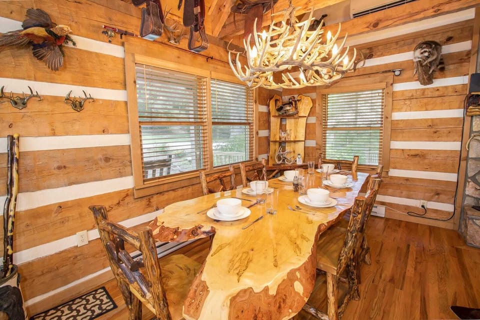 Custom Live Edge Slab Dining Table and Antler Chandelier