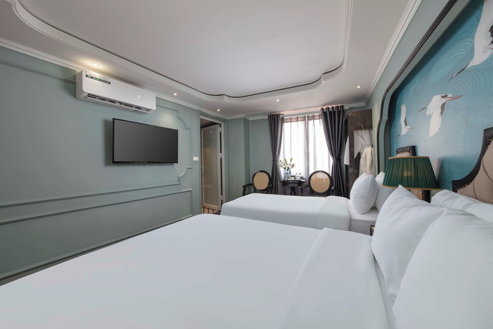 Family Quadruple Room | Minibar, in-room safe, desk, laptop workspace
