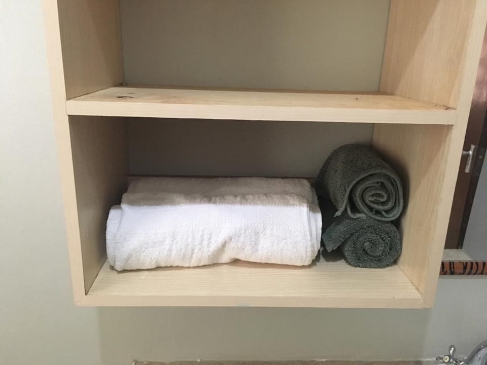 Shower, free toiletries, slippers, towels