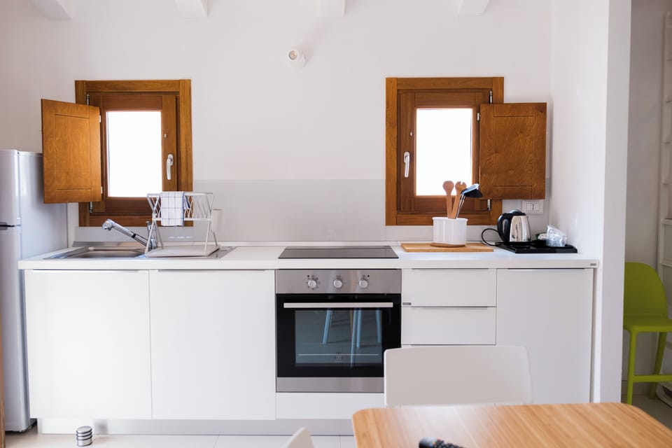 Comfort Apartment | Private kitchen | Full-size fridge, oven, stovetop, coffee/tea maker