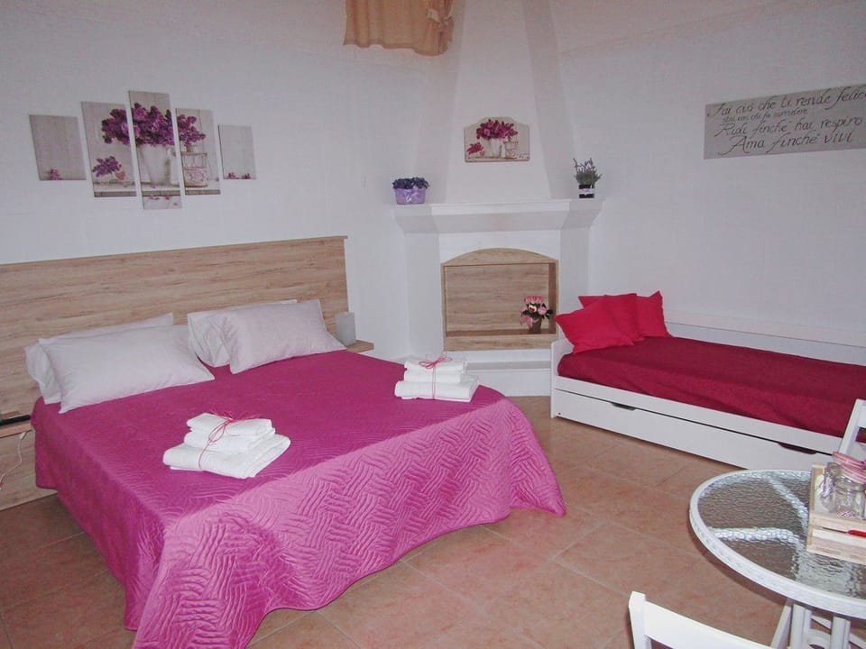 Basic Quadruple Room, Shared Bathroom | Iron/ironing board, cribs/infant beds, free WiFi, bed sheets