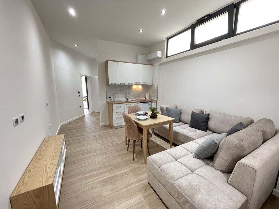 Comfort Apartment, 1 Bedroom, Balcony | Living area | 33-inch Smart TV with cable channels, heated floors