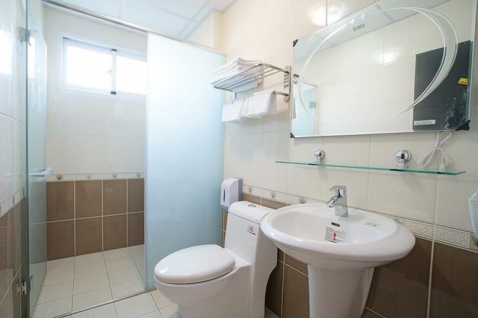 Quadruple Room, Patio | Bathroom | Shower, free toiletries, hair dryer, slippers