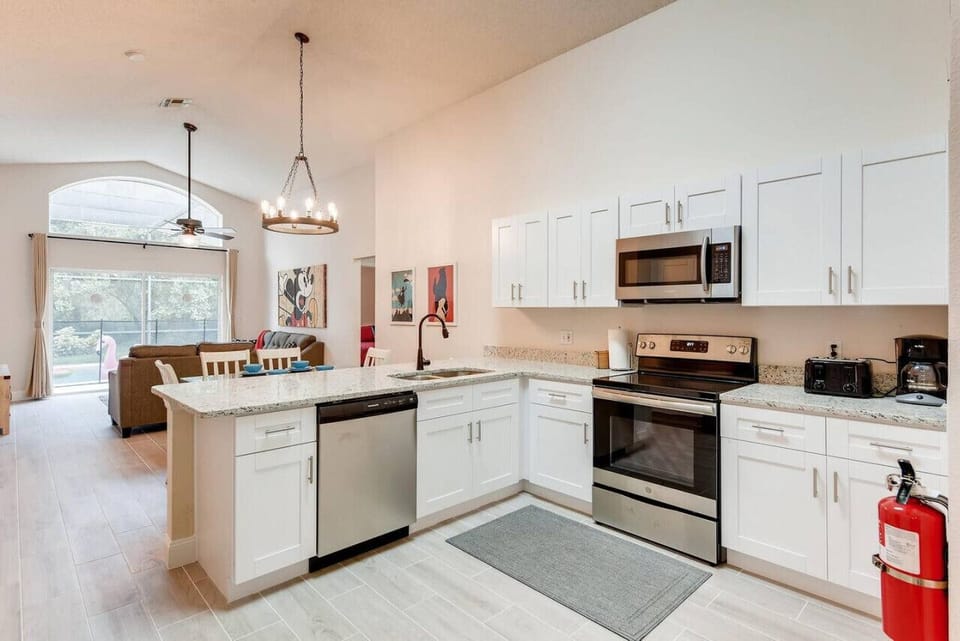 Well-equipped kitchen with ample cabinetry and stunning granite countertops.