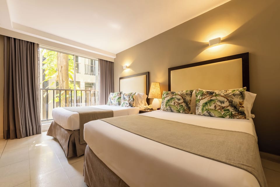 Twin Room | Minibar, in-room safe, desk, soundproofing