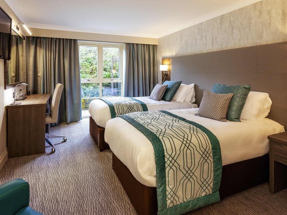 Premium bedding, down comforters, pillowtop beds, in-room safe
