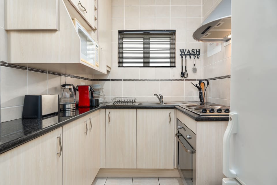 Comfort Apartment, 2 Bedrooms | Private kitchen | Full-size fridge, microwave, oven, stovetop