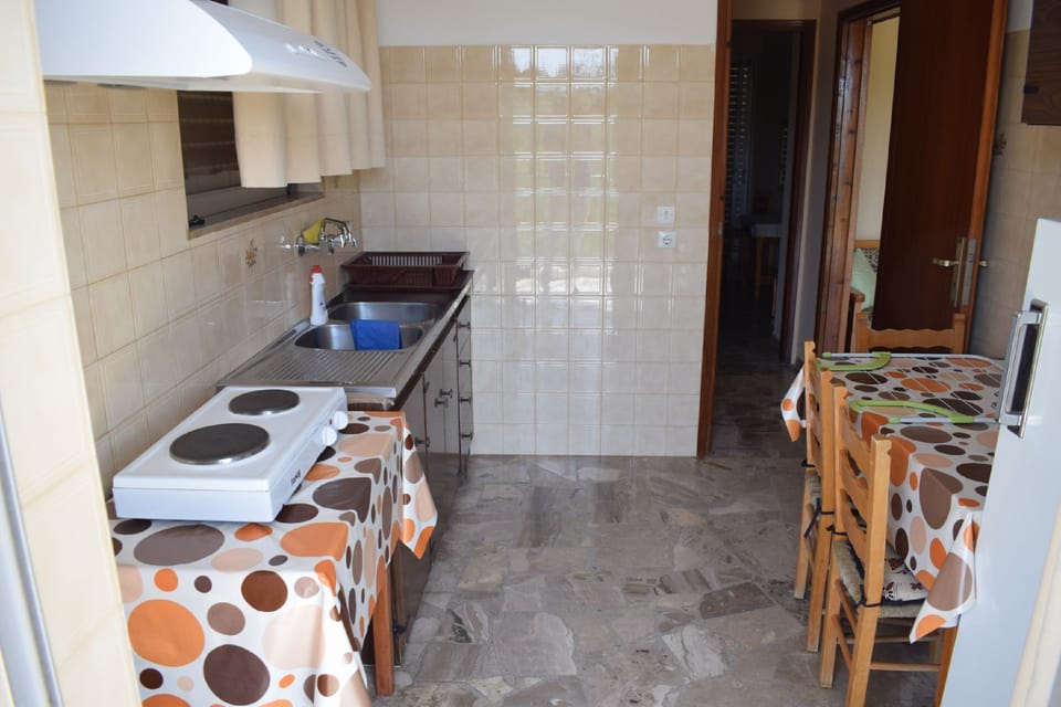Apartment, 2 Bedrooms | Private kitchenette | Full-size fridge, stovetop, coffee/tea maker, electric kettle