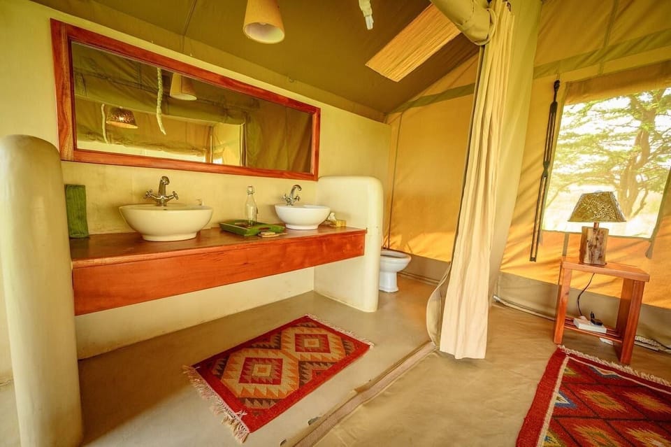 Superior Tent | Bathroom | Shower, rainfall showerhead, designer toiletries, towels
