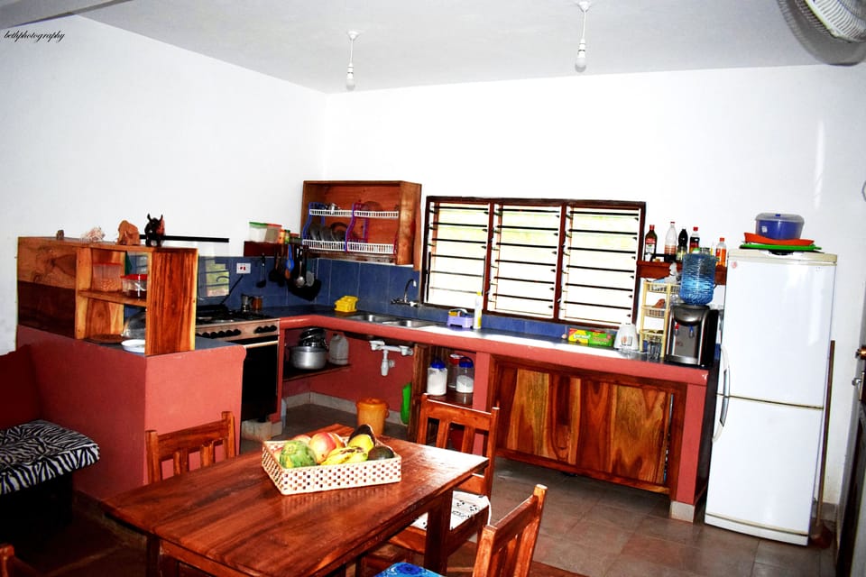 Villa | Private kitchen | Full-size fridge, microwave, oven, stovetop