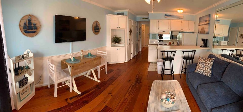 Living Rm/ Kitchen. Full size refrigerator, oven stove 
 microwave. Keurig